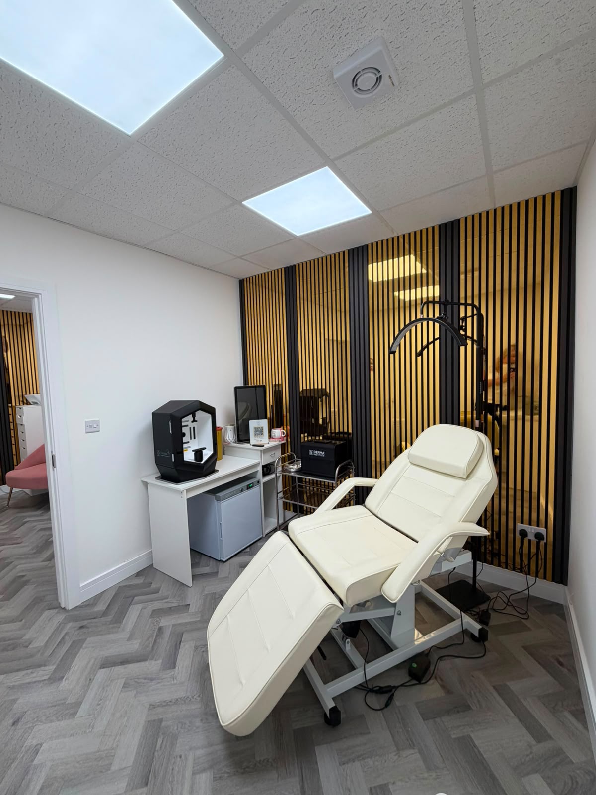 Treatment room showing sink area and herringbone flooring