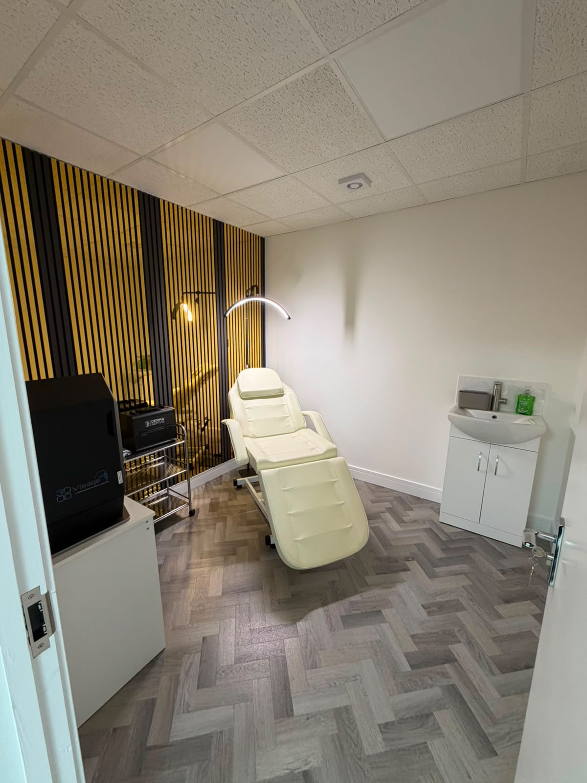Treatment room entrance view with modern lighting
